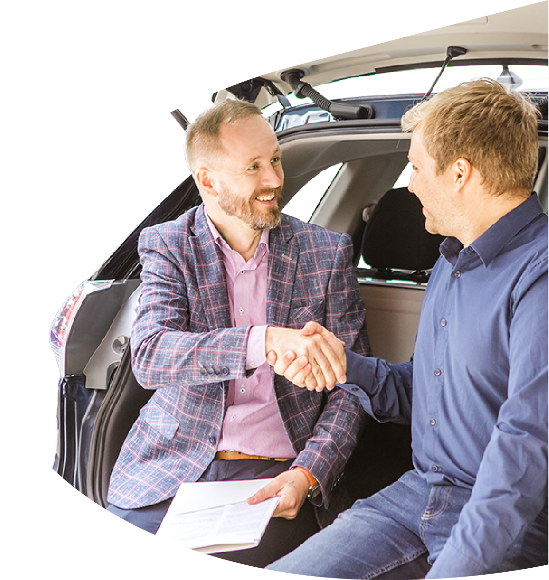 Salesperson presenting top recommended used cars to a customer